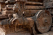 The great Chola temples of Tamil Nadu - The Airavatesvara temple of Darasuram. Detail of the prancing horses pulling wheels carved in high relief on the basement of the porch extension of the mandapa. 